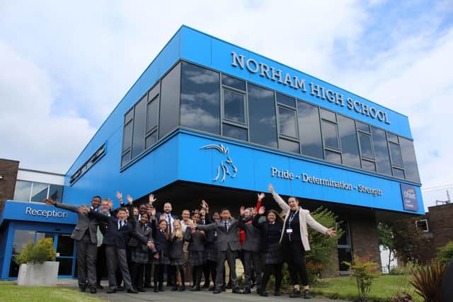 A group of Norham High School pupils and staff celebrate the very positive Ofsted report.