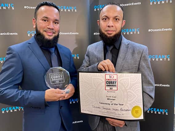 Raju Ahmed and Kamal Uddin Bari celebrate Dilshad Tandoori Indian Takeaway being named takeaway of the year at the English Curry Awards.