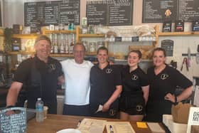 Robson Green with staff at T's Cakes and Bakes in Rothbury.