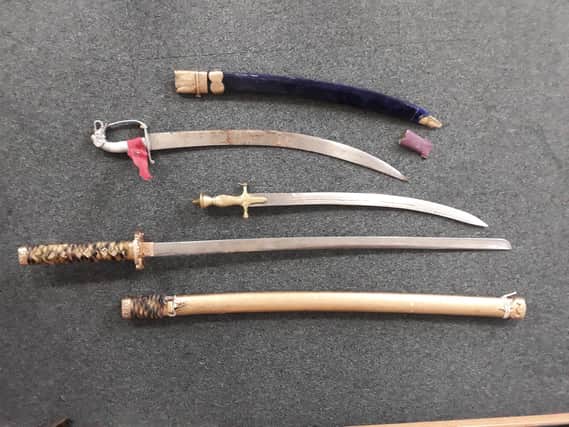 Some of the swords and knives handed in to police.