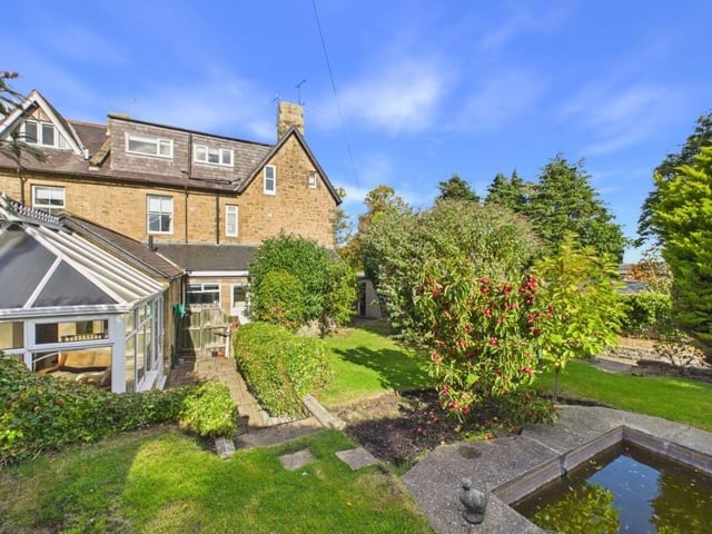 Aydon House is complemented by a mature English cottage-style garden.