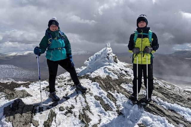 Henry and Ewan Mair Chapman on the summit of Meall nan Tarmachan, Southern Highlands.