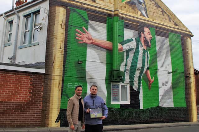 Shad Saleem, owner of Gino's, and Blyth Spartans club photographer Kris Hodgetts with the finished mural.