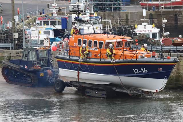 Seahouses lifeboat, Grace Darling, is lowered into the water for its final journey from the port. Picture: Ian Clayton/Seahouses RNLI