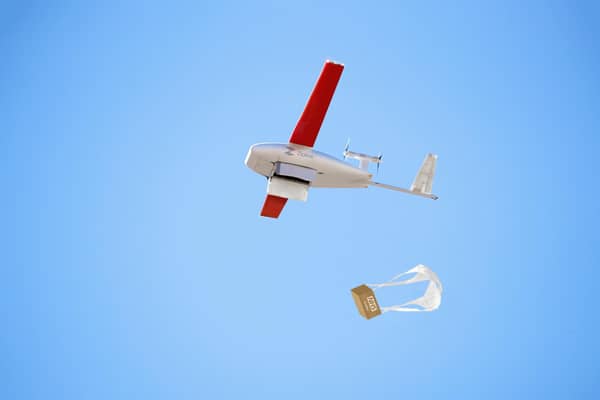 The mostly-autonomous drones will deliver payloads by parachute to NHS sites. (Photo by Zipline)