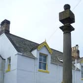 The top section of the Mercat Cross, located on land north of Crosslea in School Road, Coldingham.