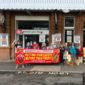 Campaigners protest plans to close the ticket office at Berwick Railway Station.