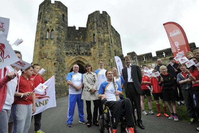 The Duke and Duchess of Northumberland with Stephen Miller and the other baton bearers.