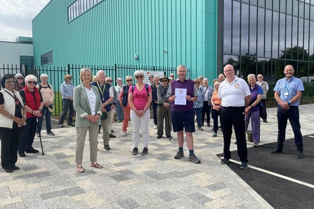 Gordon Allan receives the Sport Tynedale Award outside Ponteland Leisure Centre on behalf of Ponteland Health Walks.