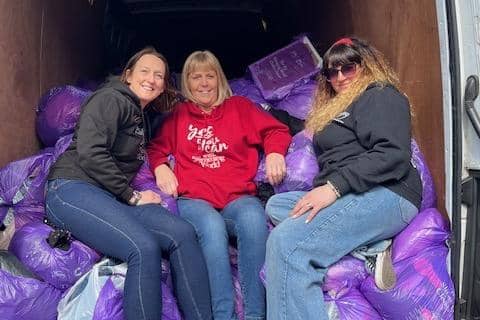 From left, Slimming World consultants Leanne Mavin-Brennand, Jill Heslop, and Fi Warren with the donated clothes. (Photo by Leanne Mavin-Brennand)