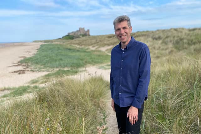 Villages by the Sea presenter Ben Robinson on the beach at Bamburgh. Picture: Purple Productions/Dave Minchin.