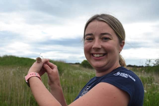 Sophie Webster and a harvest mouse at the East Chevington nature reserve. Picture by Joel Ireland.