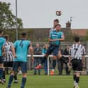 Ashington FC's Nathan Buddle wins a header in the game against Consett. Picture: Ian Brodie