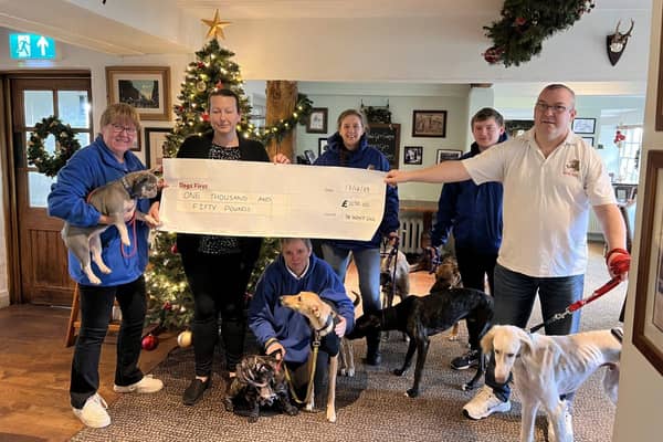 Kirsty Dodds hands over the cheque to Dogs First. Picture: Pat Heard