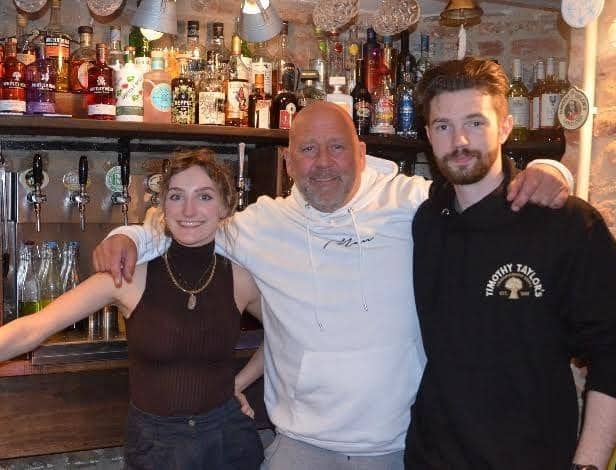 Pete Manion in the middle with his staff from Harry's Bar in Alnwick.
