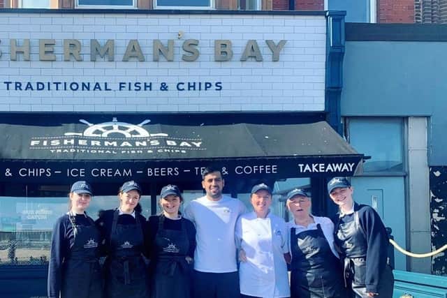 The staff of Fisherman's Bay outside the restaurant on the Whitley Bay seafront. Manager Steven Dhillon says the team's customer service is a key reason for their success so far.