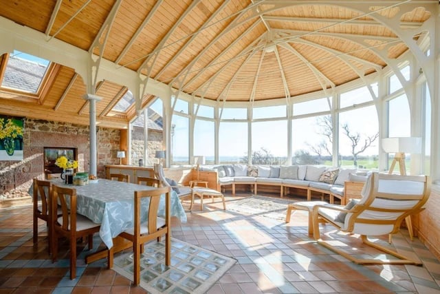 An impressively spacious, light and airy conservatory with outstanding panoramic views.
