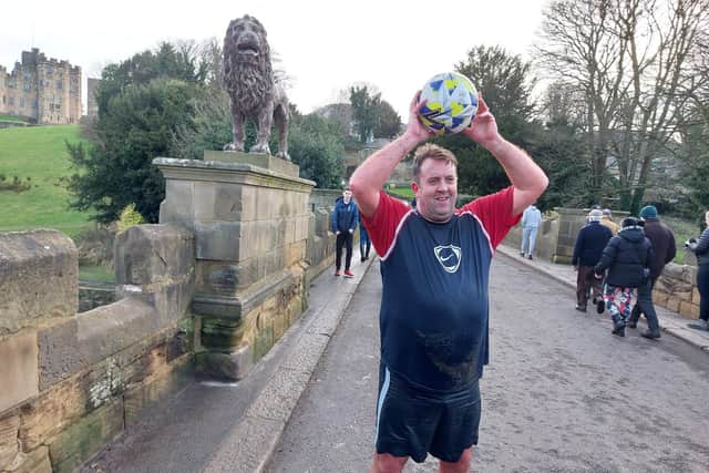 Steven Temple with the match ball on Lion Bridge.
