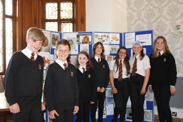 Duchess's Community High School pupils with their Lion Trail app designs.