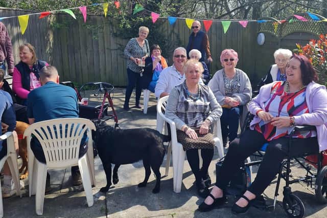 Residents and their families enjoy the Easter Fair at Holywell House Care Centre.