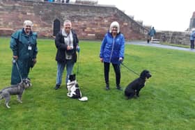 Bamburgh Castle visitors with volunteers