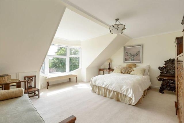 The main bedroom is spacious and flooded with light through its generous sized windows