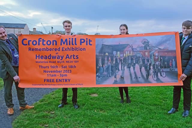 Students and staff from Bede Academy with a  banner publicising the exhibition. (Photo by Alan and Susan Devlin)