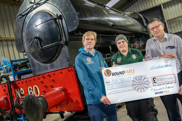 Alnwick Round Table chairman Graham Brown and PR officer Andy Hunt present a £500 cheque to Aln Valley Railway trustee Mark Hayton. Picture: Jane Coltman Photography