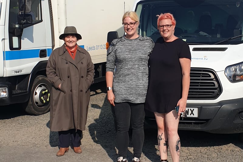 Kathryn Tannock, left, and friend Leah Meeks, from Stamford Lincolnshire with the blonde hair, have their socially-distanced picture taken with Brenda Blethyn while she was filming at Boulmer.