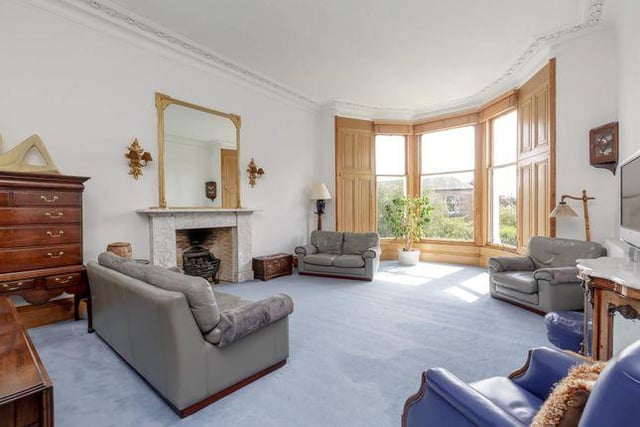 The property boasts a large living room, which lets in plenty of natural light through its floor-to-ceiling windows