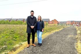 Martin Thrumble of Persimmon North East and estate resident Julia Dowd on the new footpath. (Photo by LDRS)