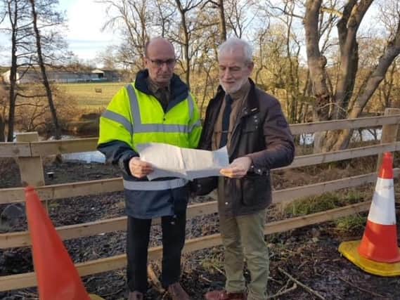 Cllr John Riddle, cabinet member for local services and Shillbottle councillor Trevor Thorne at the site of the landslip.
