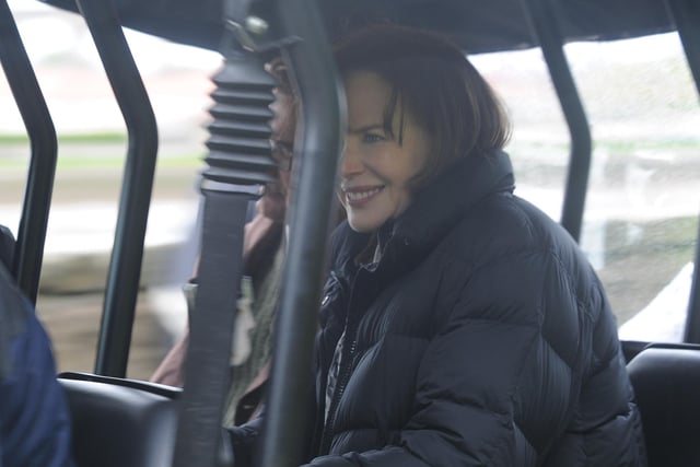 Nicole Kidman is driven between scenes by the River Tweed.