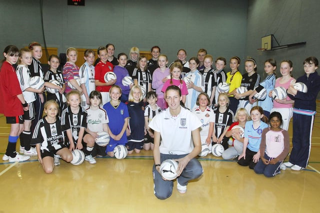 England and Everton player Jill Scott with girls who took part in training sessions at Willowburn in Alnwick in 2008.