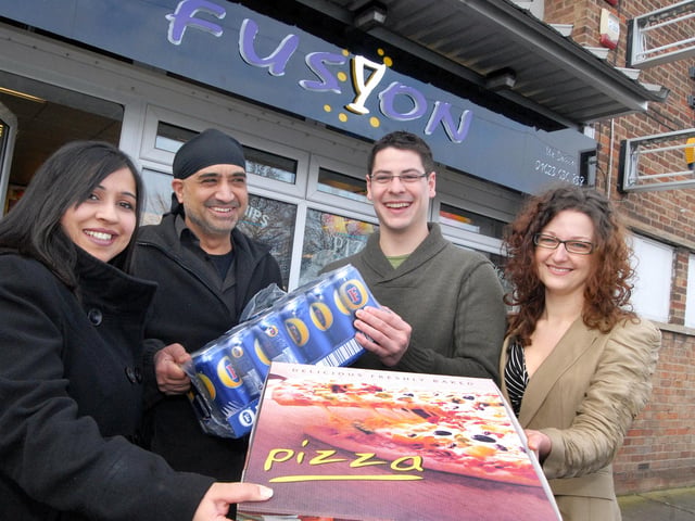 Owners Raaj Takhar and husband Iqbal Singh handed over a pizza and beer prize to Steven Newbury and Gemma Riley back in 2011