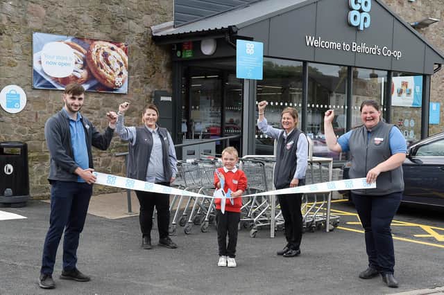 Store manager Tammy Robson, second from right, and staff, Joseph Threlfall, Lisa Court and Louise Melvin, with help from Ewan Middleton, one of the pupils from Belford Primary School, officially open the new-look Co-op. Picture by Chris Watt, www.chriswatt.com