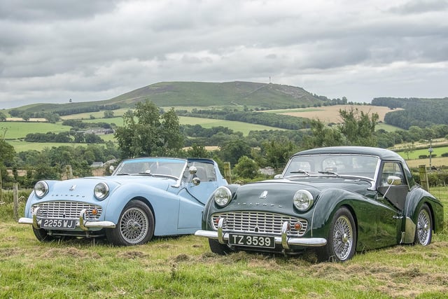 The countryside provides the perfect backdrop to admire the vintage vehicles.