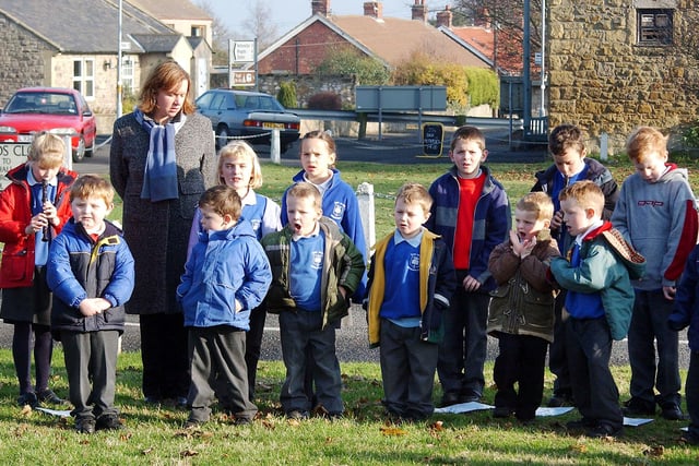 A memorial service on Remembrance Day (Novemver 11) 2003 at Longhorsley village green, held by the headteacher of Longhorsley First School, Elizabeth Bainbridge, and attended by the pupils of the school.