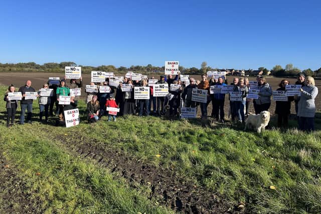 Protesters at the site of the proposed housing development on the outskirts of Ashington.