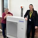 Tenant Edna Smith and Bernicia environmental sustainability advisor Poppy Atterton, outside Edna’s home in Norham with a new air source heat pump.