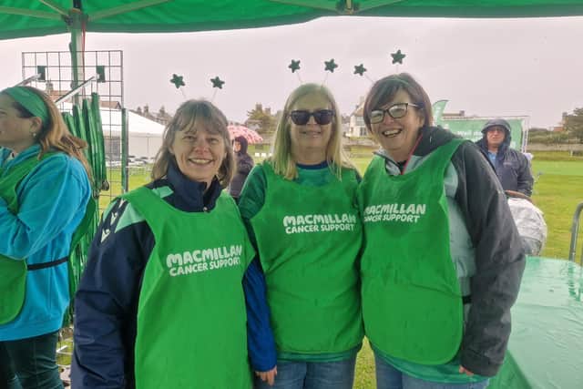 Jacqueline (right) with her sister and friend volunteering at last year's Mighty Hike.