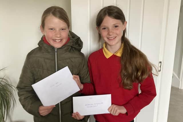 Imogen Richaby and Kasey Ord raised cash for their school.