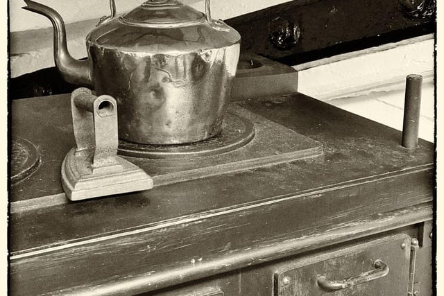 A steel teapot sits atop an old stove at Beamish Museum.