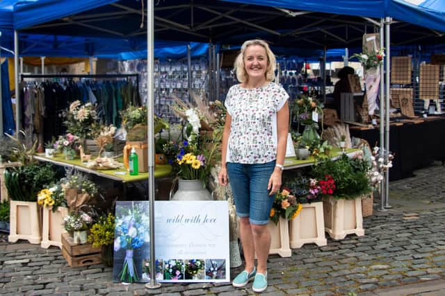 Sharon Wright takes charge of the Northumberland Estates sponsored stall in Alnwick market.