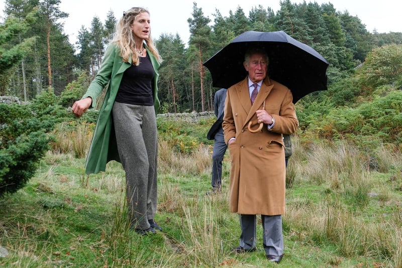 Charles speaks with Lady Riddell as he visits a site of wild Juniper seedlings planted in heather moorland during a visit to the Moorland Spirit Company.