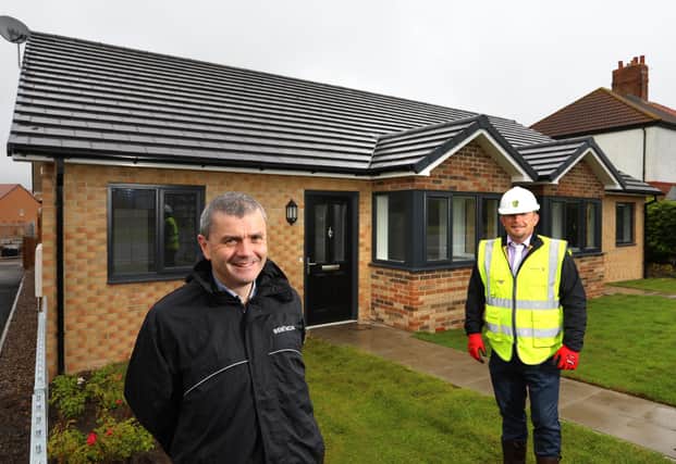 Michael Farr, Bernicia executive director of assets and growth (left) and Ian Avis, Tolent construction manager, outside the new bungalows in Cramlington.