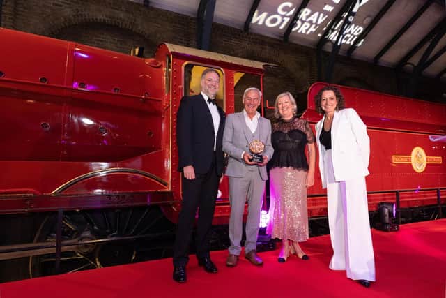 Serenity Farne Island Boat Tours representatives with VisitEngland board member Fiona Pollard, director general of the Caravan and Motor Home Club Nick Lomas, and compere Alex Polizzi in front the Hogwarts Express on stage.
