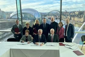 Levelling up secretary Michael Gove signs the North East devolution deal with local council leaders at the Baltic art gallery in Gateshead. Photo: LDRS.