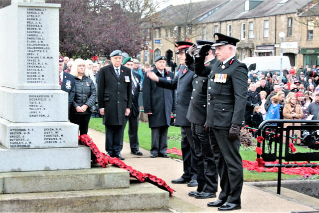 Dignitaries from the Armed Forces pay their respects at the war memorial in Bedlington.