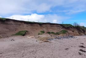 The fifth green that borders the beach is slipping down onto it as sand is removed from the bank.